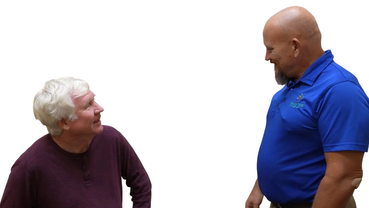 Dr. Micah Carter talking with male chiropractic patient