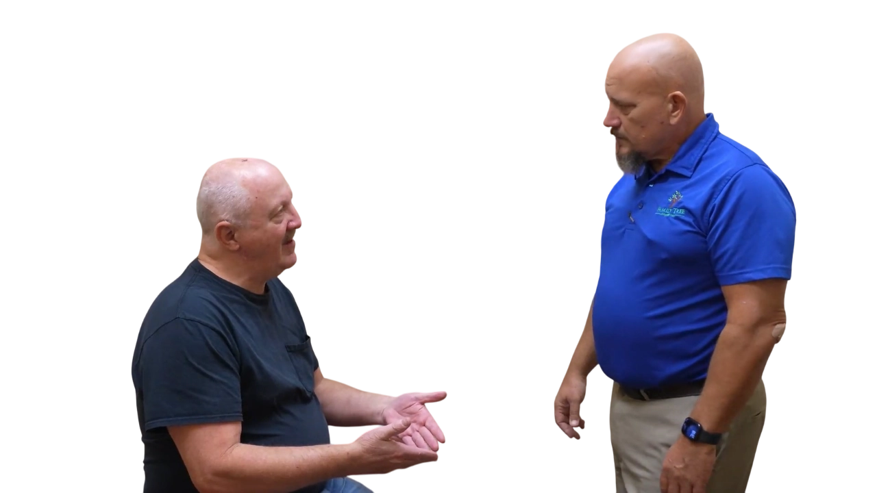 Dr. Micah Carter hearing about a patient's chiropractic success results