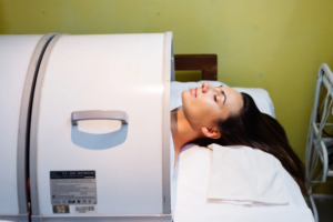 Young woman lying on table during rejuvenation procedure