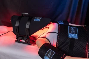 Contour light therapy device on female chiropractic patient