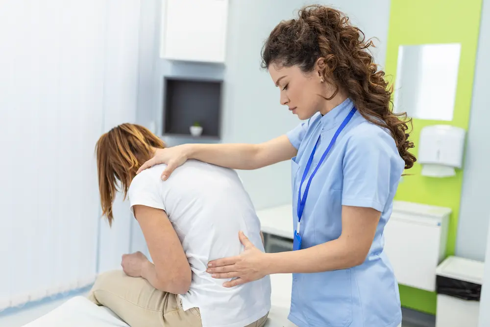 Chiropractor providing care for spinal stenosis to reduce nerve pressure and improve mobility